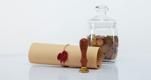 Last Will Executor Fees document, seal and money in jar