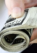hand with money roll