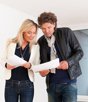 man and woman checking contract