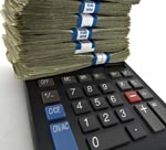 calculator with stack of money